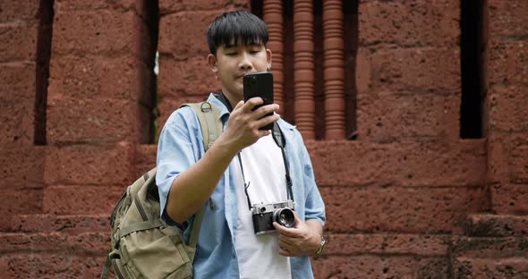 Man checks location on smartphone online map