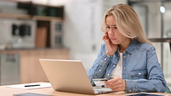 Online Shopping Loss on Laptop By Young Casual Woman 
