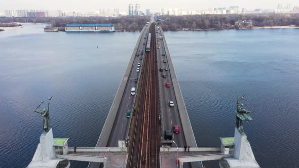 Metro Train Moving on Bridge Railway. Aerial View Car Traffic on Highway Bridge