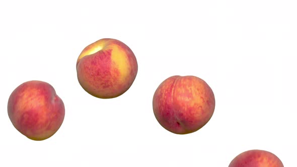 Jumping Ripe Peaches On Withe Background
