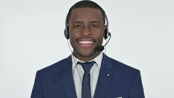 Smiling African Businessman with Headset for Call Center White Background