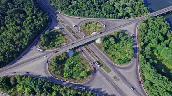 Aerial View of Road Junction with Moving Cars