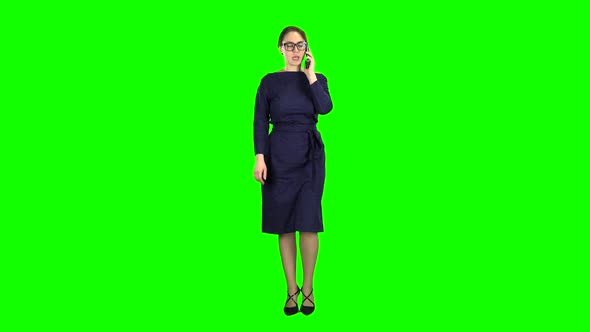 Businesswoman Is Going To a Meeting and Talking on the Phone. Green Screen