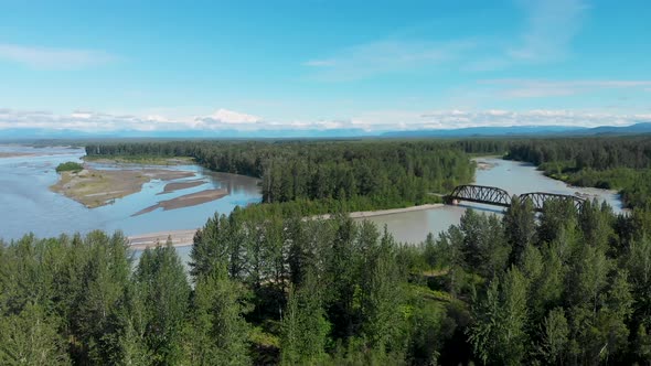 4K Drone Video of Alaska Railroad Train Trestle Bridge with Mt. Denali in Distance near Talkeetna, A