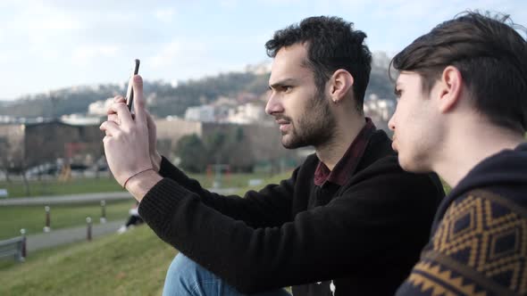 Men Pose With Phone