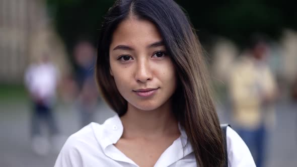 Attractive College Girl Smiling on Camera Outdoor