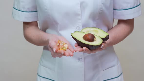 Nutritionist Doctor Healthy Lifestyle Concept - Holding Organic Avocado