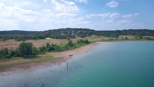 Aerial shots of a lake park in Texas on the popular Canyon Lake while barely any boats are cruising