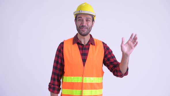 Happy Bearded Persian Man Construction Worker Waving Hand