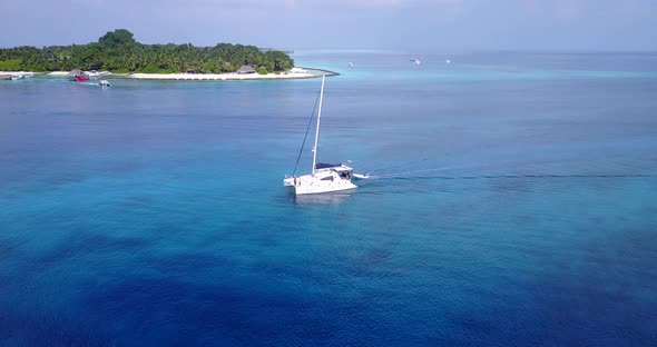 Luxury birds eye island view of a paradise sunny white sand beach and turquoise sea background in vi