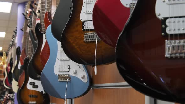 Many New Different Multicolored Electric Guitars are Sold in the Store