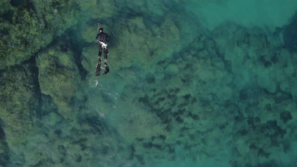 Exotic Underwater Hunter Swimming and Spear Fishing in Caribbean Sea