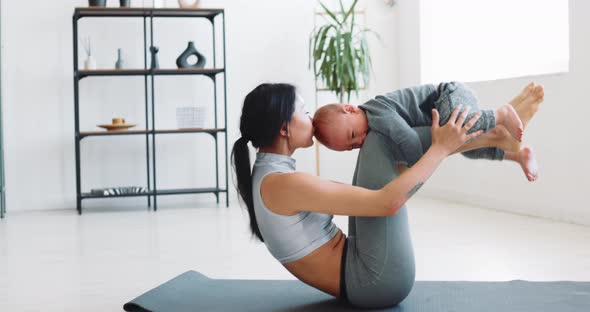 Mom and Child Do Fitness at Home During Isolation