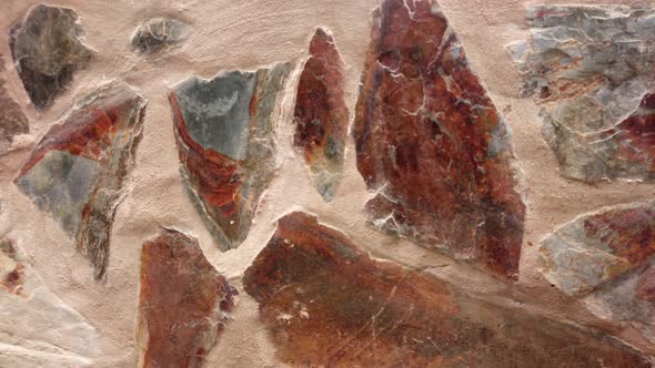 Panorama of brown stone wall. Move from left to right