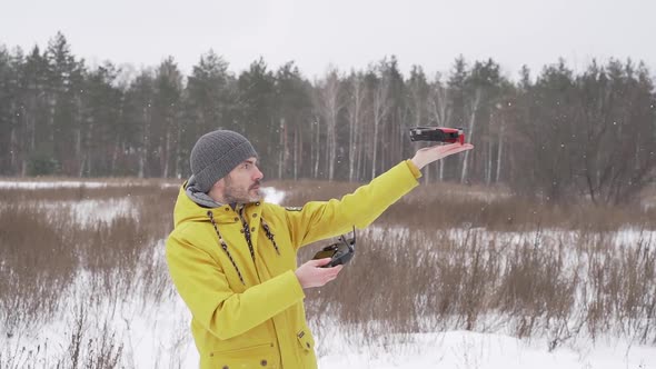 Man launching a drone from his hand