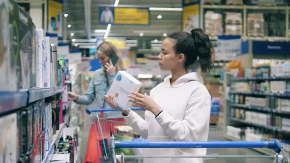 Women are Shopping in the Store Section with Dishware