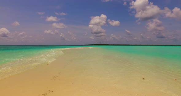 Beautiful above abstract shot of a sandy white paradise beach and aqua turquoise water background in