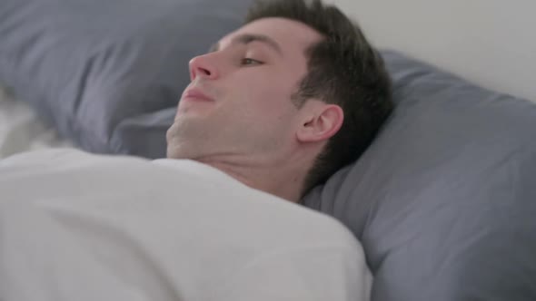 Man Going to Bed and Sleeping Close Up