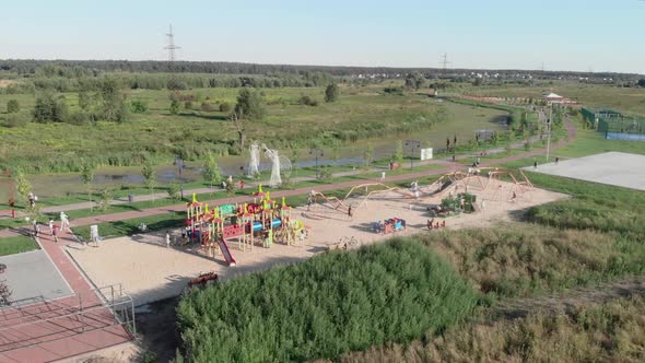 Children playground. Happy children playing on playground at sunny summer day