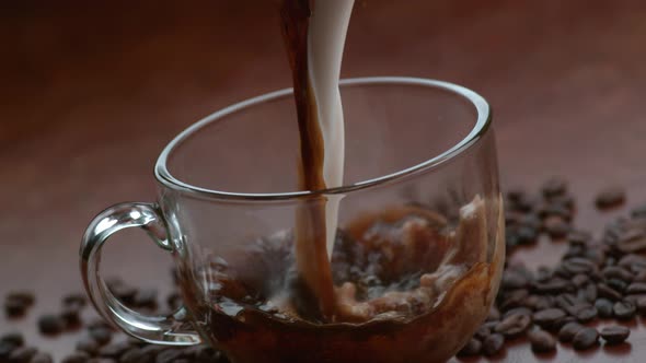 Coffee and creamer pouring together in slow motion; shot on Phantom Flex 4K at 1000 fps alt