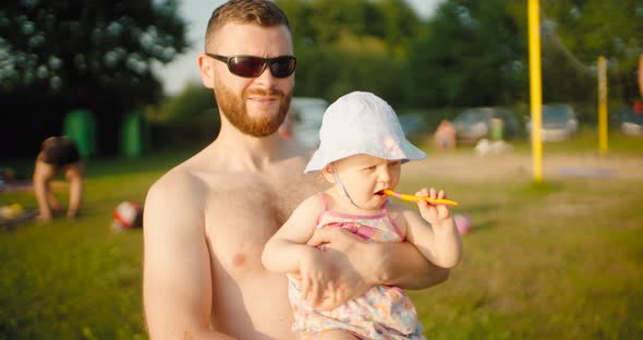 Cute toddler girl with father