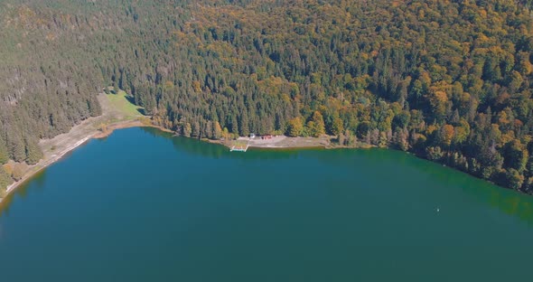 Aerial View Of Saint Anne Lake, Crater Lake At Ciomatu Mare Volcano With Dense Forest In Romania.