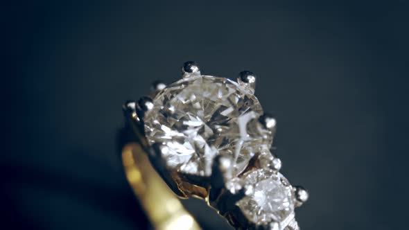 Extreme Detailed of Diamond Ring Close Up Shot While Rotating on Dark Background