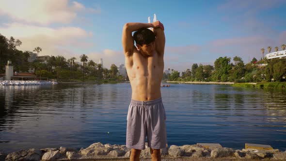 Young Asian man working out in a park in Los Angeles