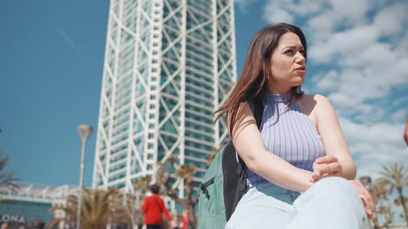 Concentrated sunny woman talking with her friend