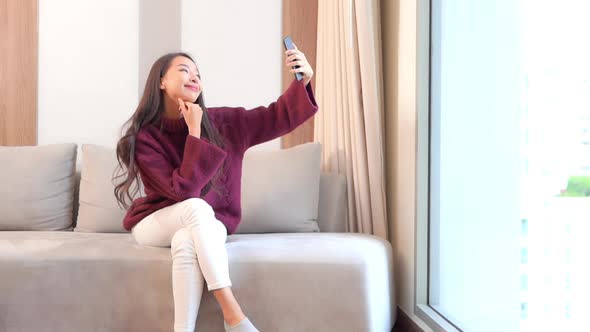 Young asian woman use smart phone