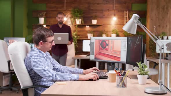 Team of Video Games Creators Showing Graphics on Computer Display