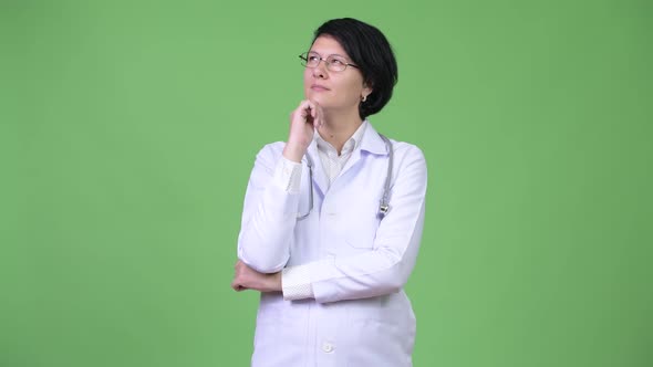 Beautiful Woman Doctor with Short Hair Thinking