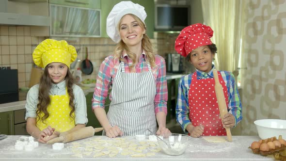 Cheerful Woman and Kids, Kitchen.