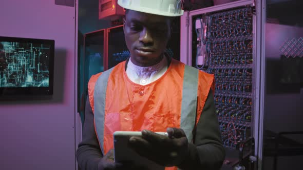 Portrait of African-American Technician in Data Center