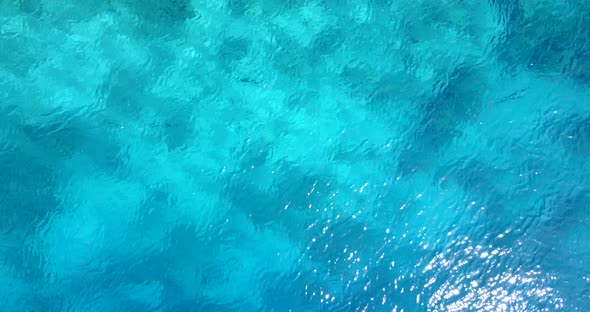 Beautiful above travel shot of a white sandy paradise beach and turquoise sea background in best qua