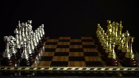 Chess Figures On A Chessboard On A Black Background 1.