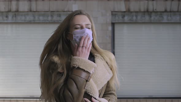 Woman Wearing Face Mask Because of Air Pollution or Virus Epidemic on the Street Background