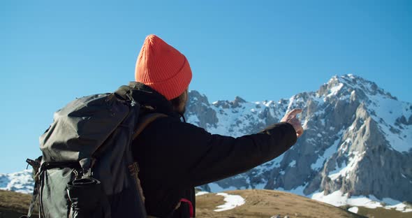 Portrait of Young Traveler Men Showing Mountain View