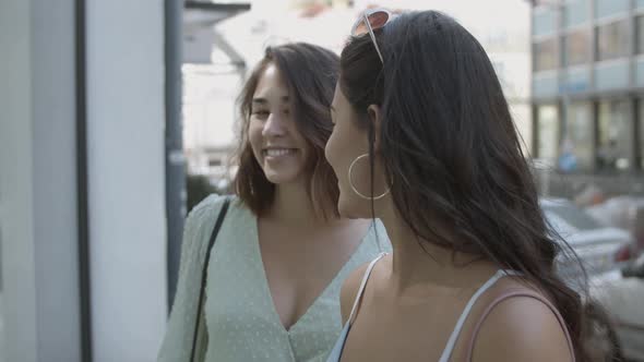 Latin Pretty Woman Talking and Long-haired Lady Listening Her