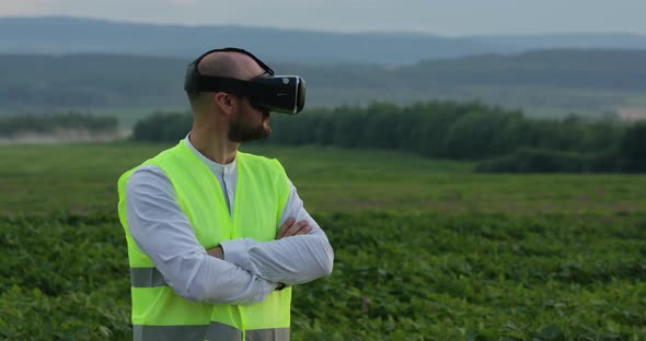 Farm Specialist Engineer Using Technology VR Monitoring Harvest Working for Agriculture Productivity
