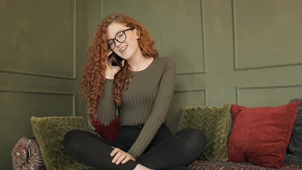 Girl with Curly Hair Talking on the Phone 