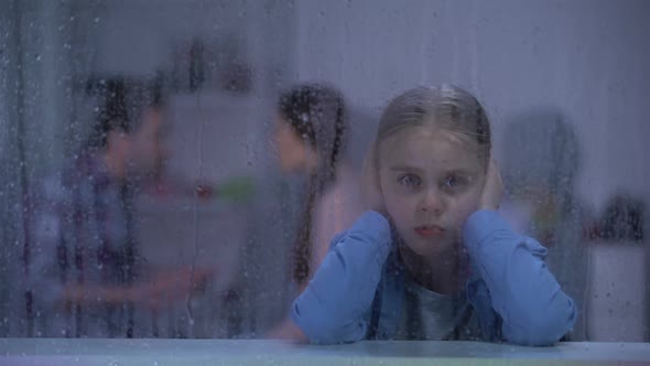 Little Girl Closing Ears on Rainy Day, Parents Quarrelling in Room, Conflict