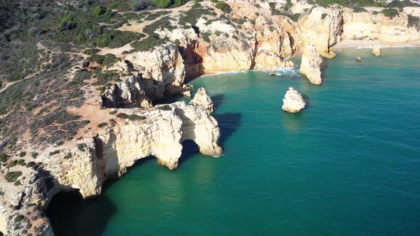 Mosque Beach and Marinha Beach to the right in south of Portugal, Aerial orbit reveal shot