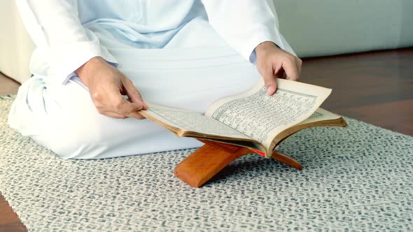 Asian Muslim Man Reading the Qur'an