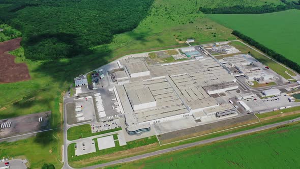 Suburban industrial zone. Aerial drone view of factory plant building