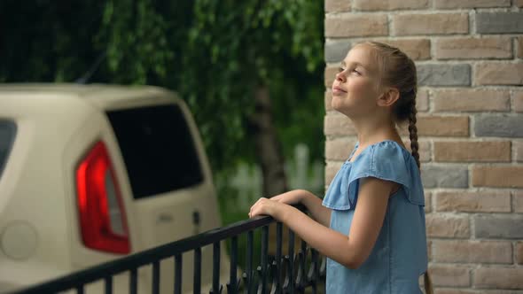 Happy Girl Enjoying Rainy Weather