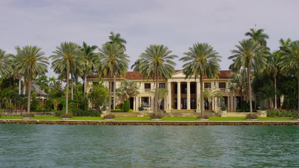 Villa with columns seen on the waterfront