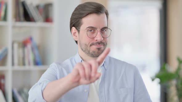 Portrait of No Sign By Man in Glasses By Finger Gesture