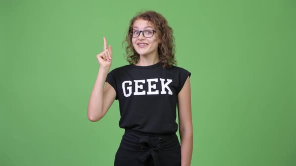 Young Happy Beautiful Nerd Woman Pointing Up