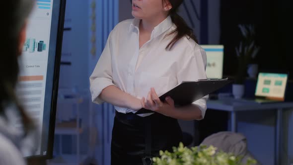 Entrepreneur Woman Explaining Management Company Statistics Using Presentation Monitor